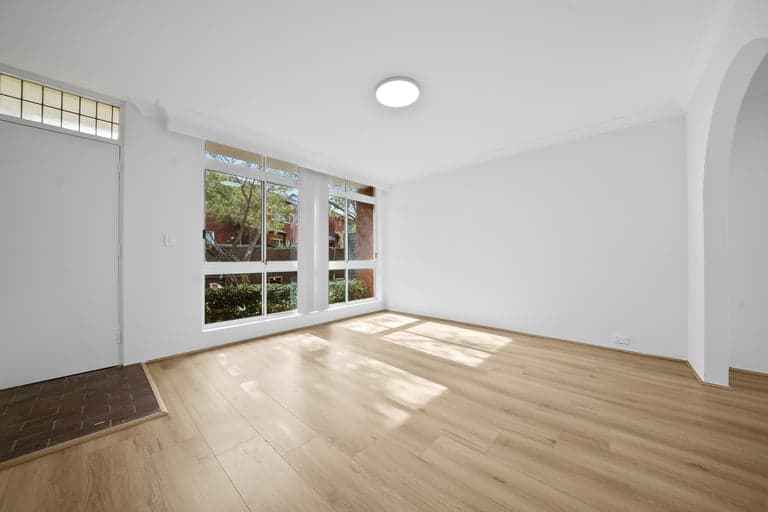 Oak hybrid flooring in a Sydney front room with a tiled entry threshold