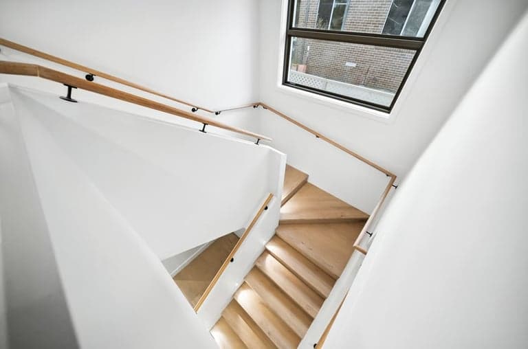 Light timber stair treads and handrail in a Sydney home renovation
