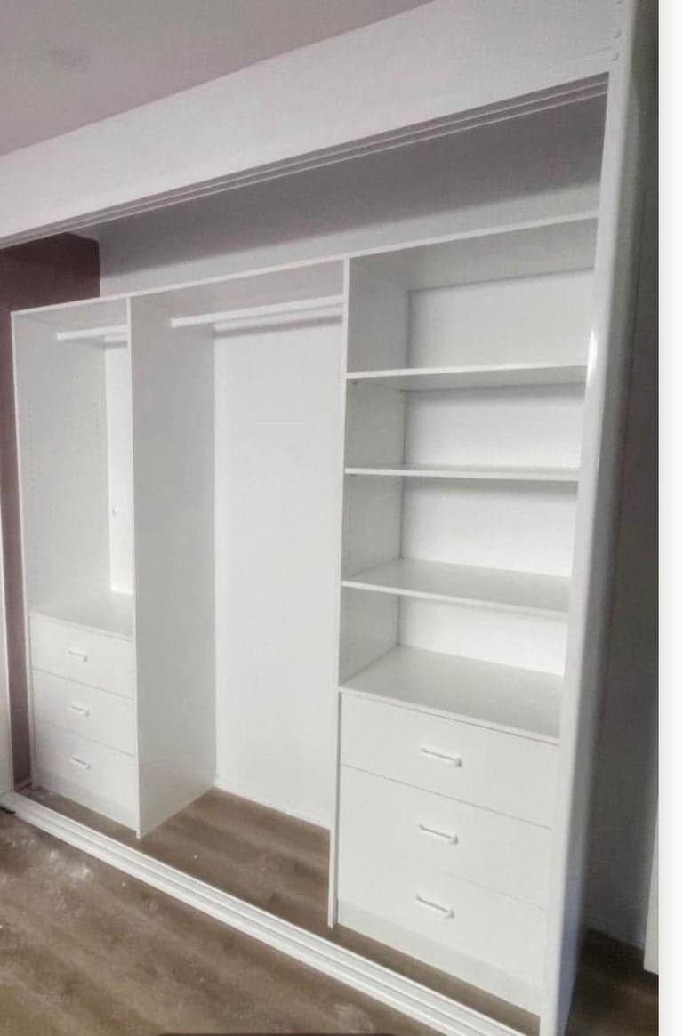 Custom white wardrobe interior in Sydney with hanging rails, shelves and drawers