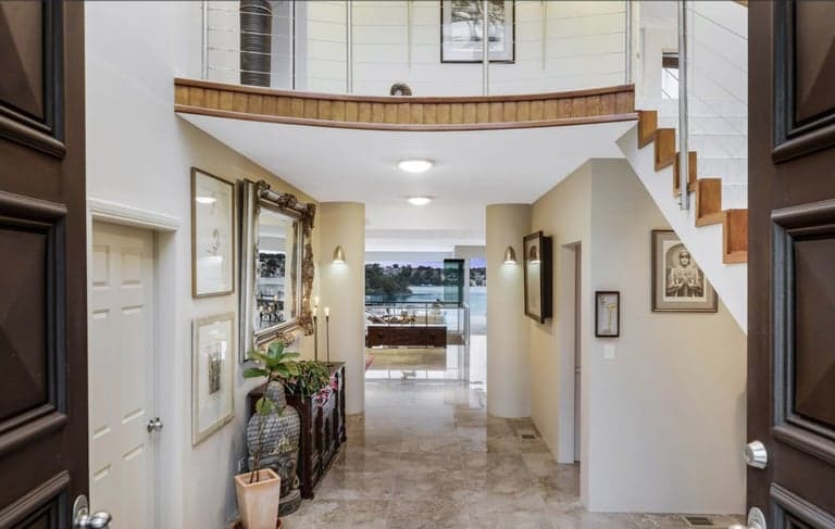 Marble entry hall in Sydney looking through to a harbour-view living room